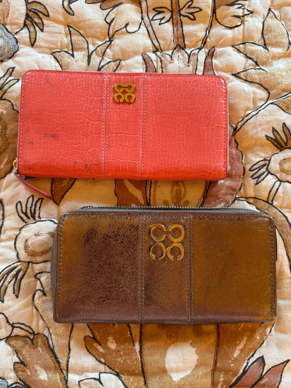 Coach Zip Wallets in Coral and Brown